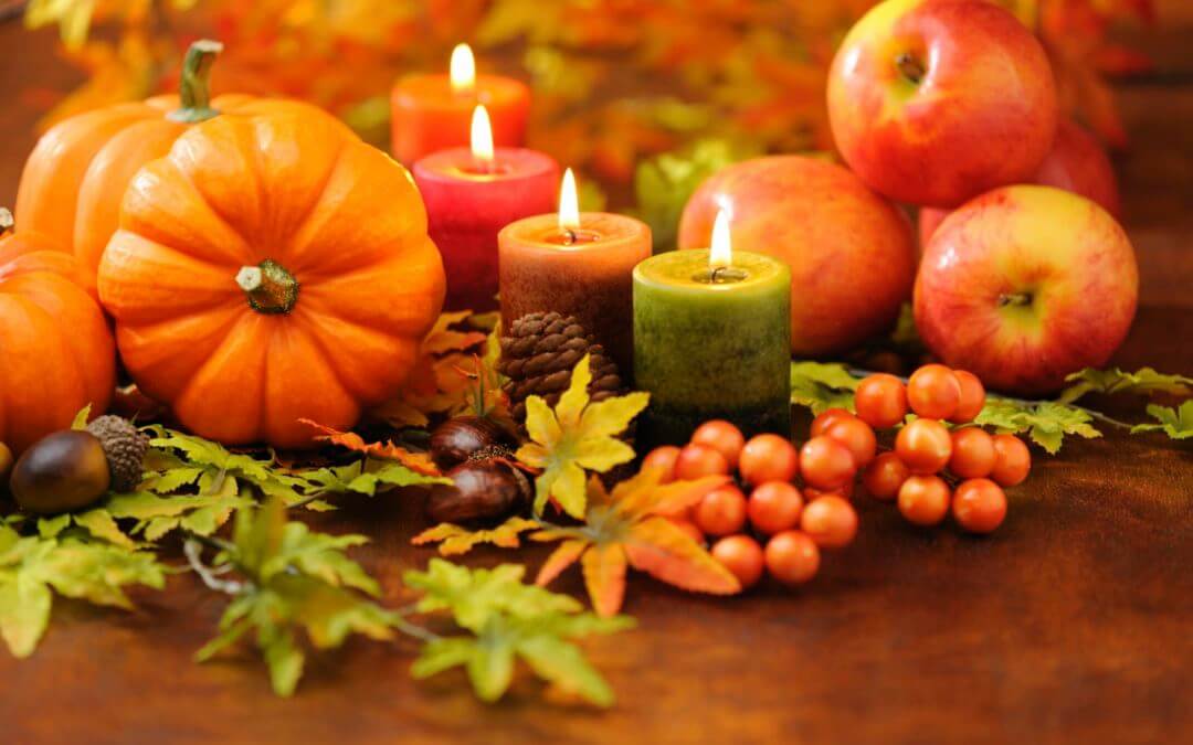 fall table with pumpkins and candles